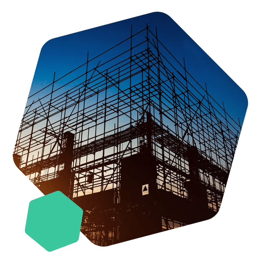 A silhouette of a construction site with scaffolding.